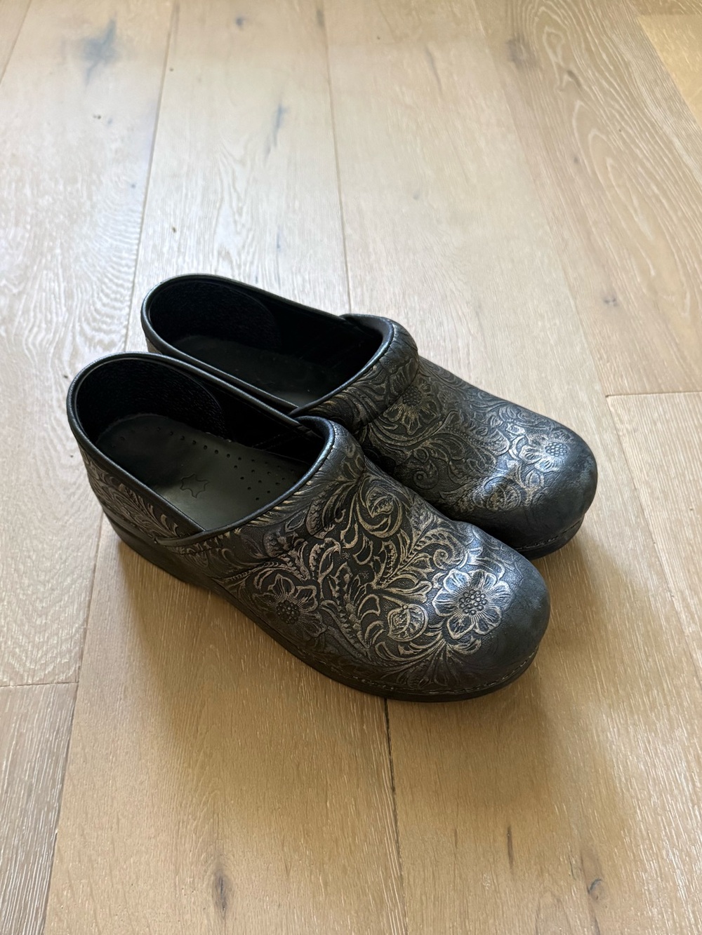 Dansko clogs with gold floral embellishment